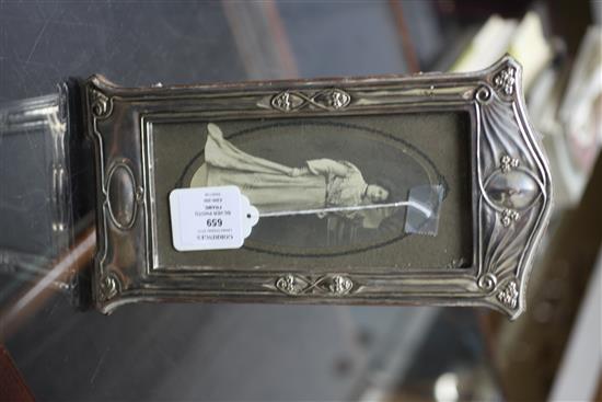 An Edwardian Art Nouveau repousse silver photograph frame, 11.25in.